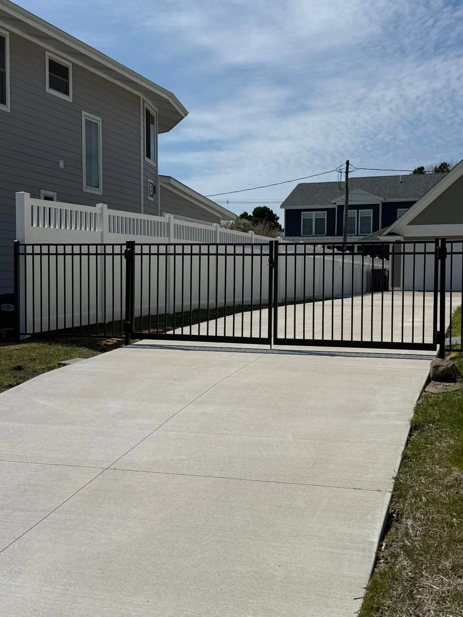 Drive gate opening with clean alignment and room for vehicle access.