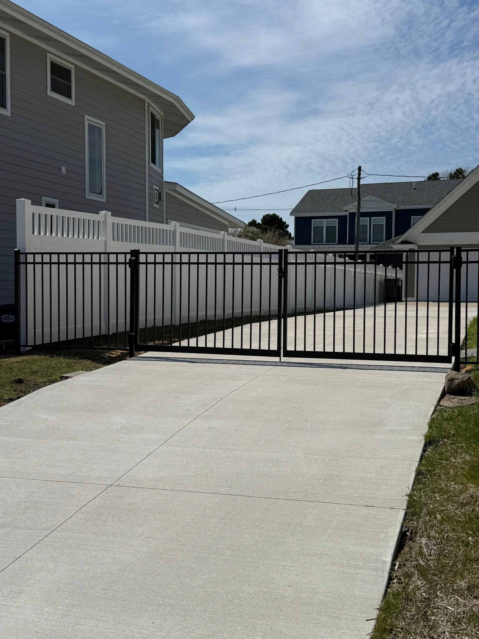 Drive gate opening with clean alignment and room for vehicle access.