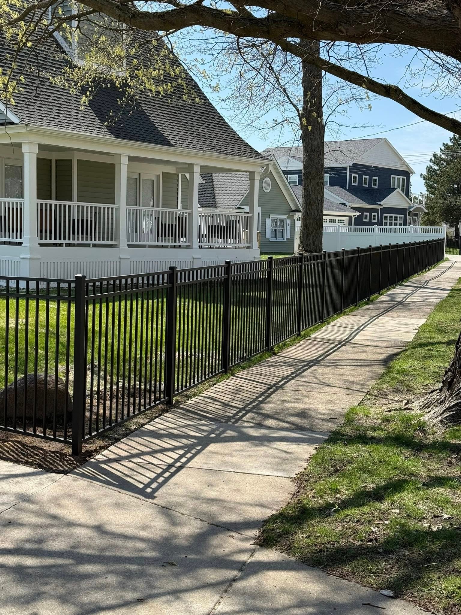 Gate opening across a driveway with winter site conditions.