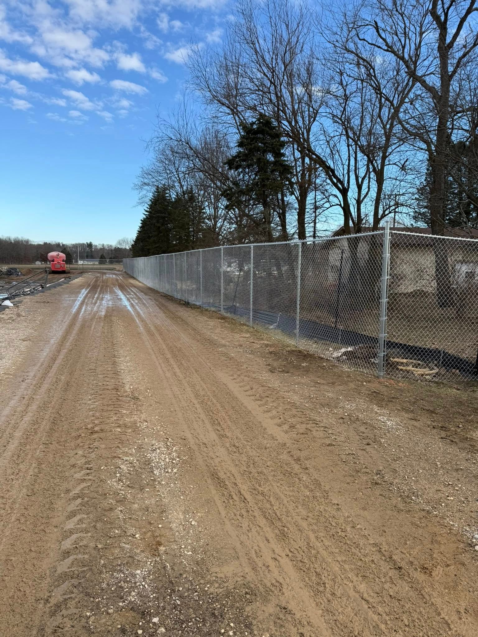 Close view of a vinyl fence line with clean posts and panels.