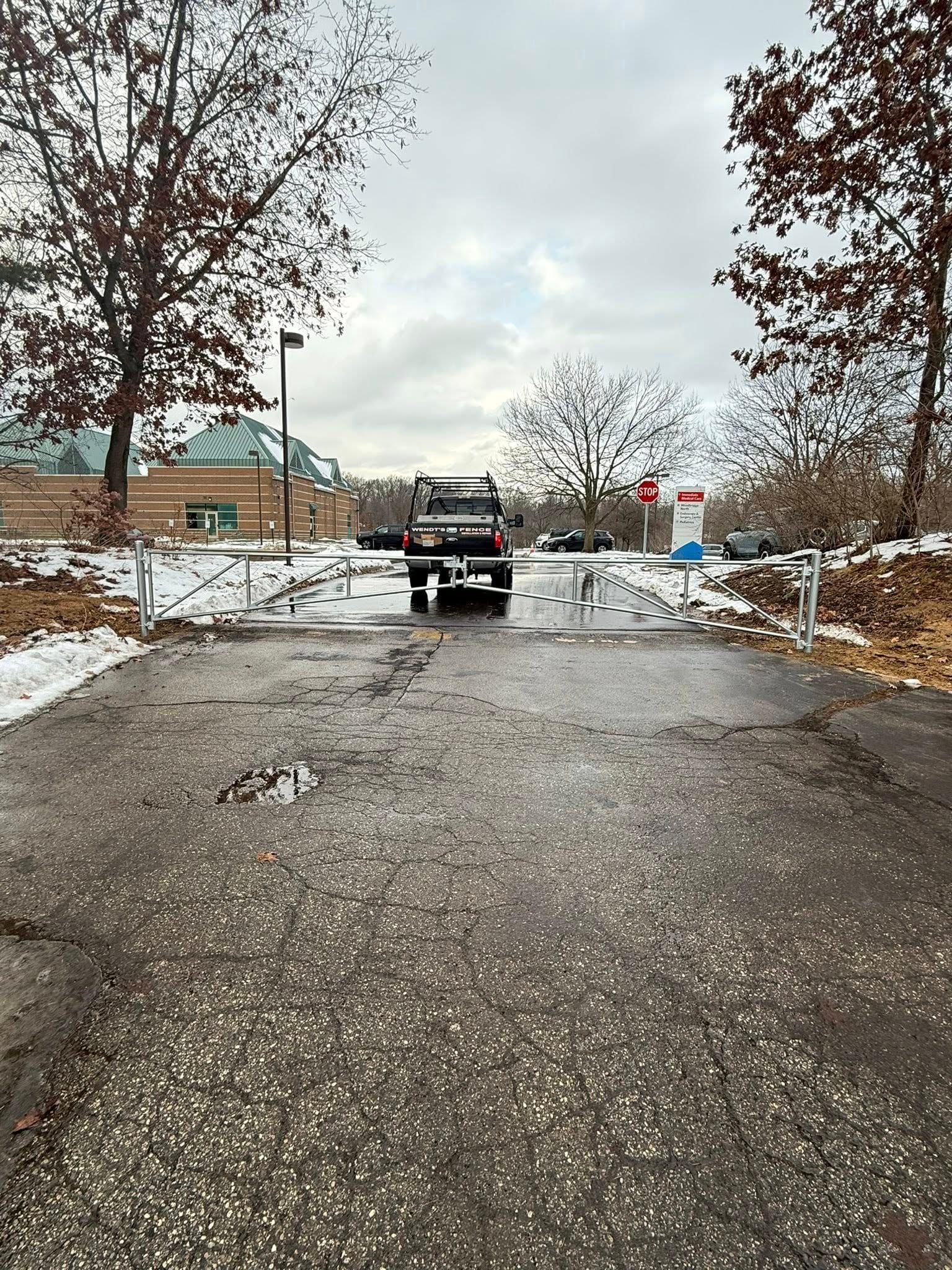 Drive gate opening with clear width for trucks and equipment.